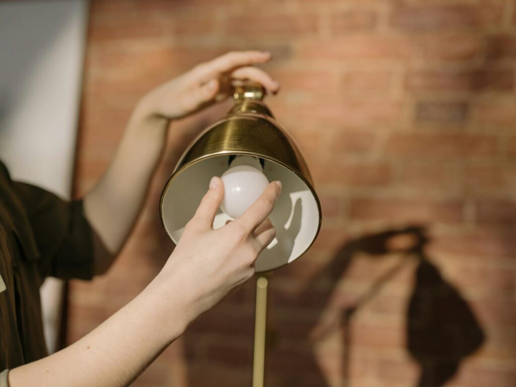 Someone changing a lightbulb