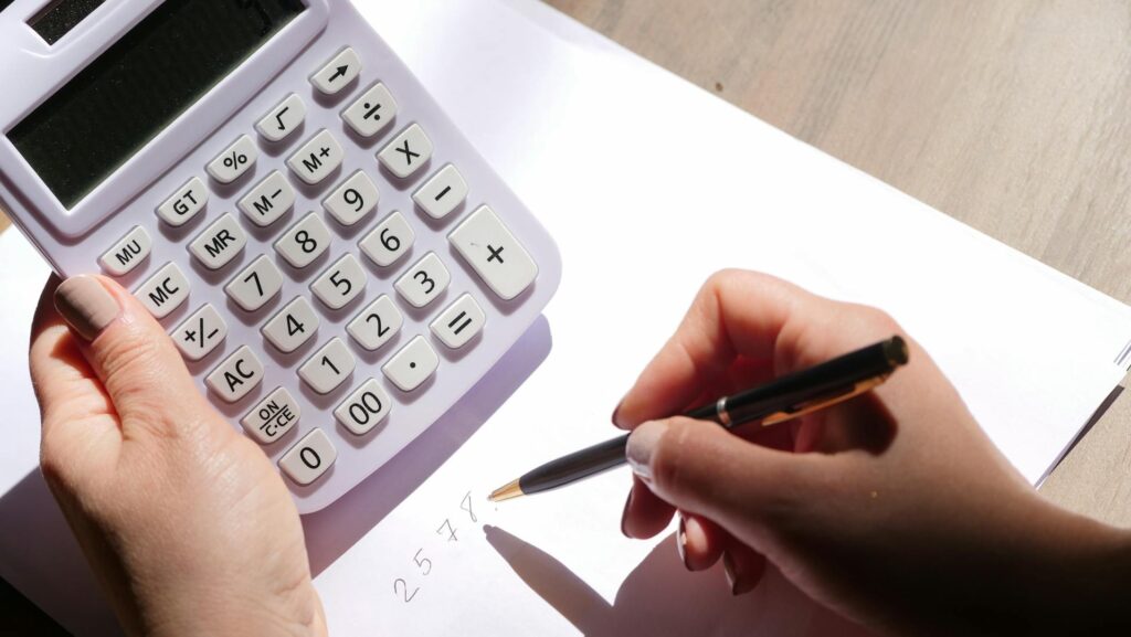 A person using a calculator